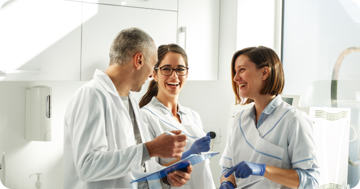 dentist talking to his assistants
