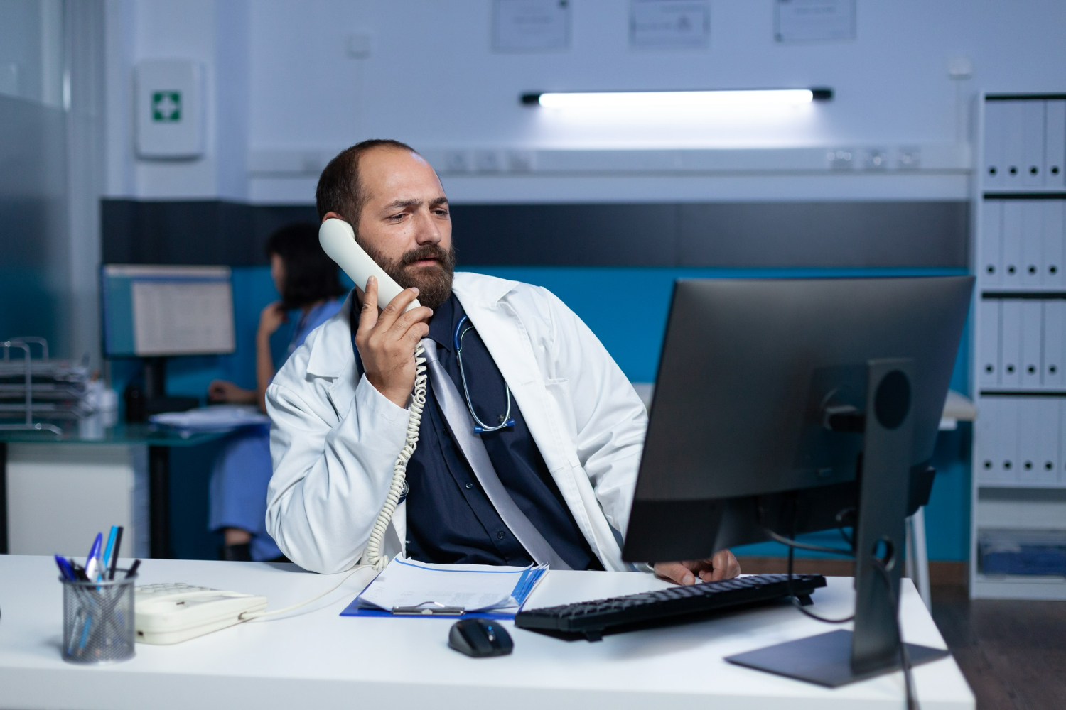 Dentist talking on the phone while sitting