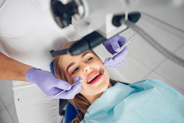 Dental Hygiene Terminology- A Handy Glossary 3 Smiling patient with braces during a dental check-up