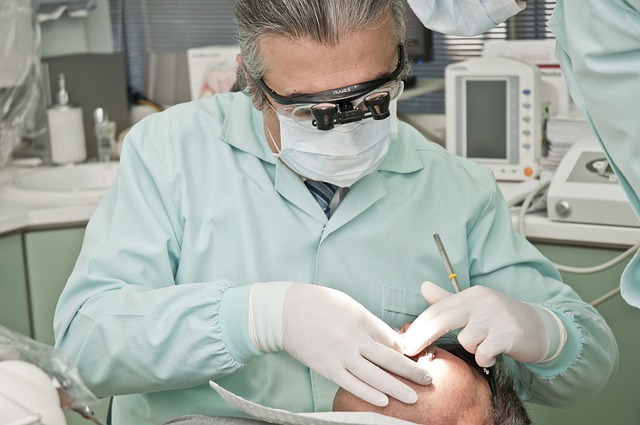 Dentist Burnout: Prevention and Coping Strategies 1 dentist doing dental procedure with his patient
