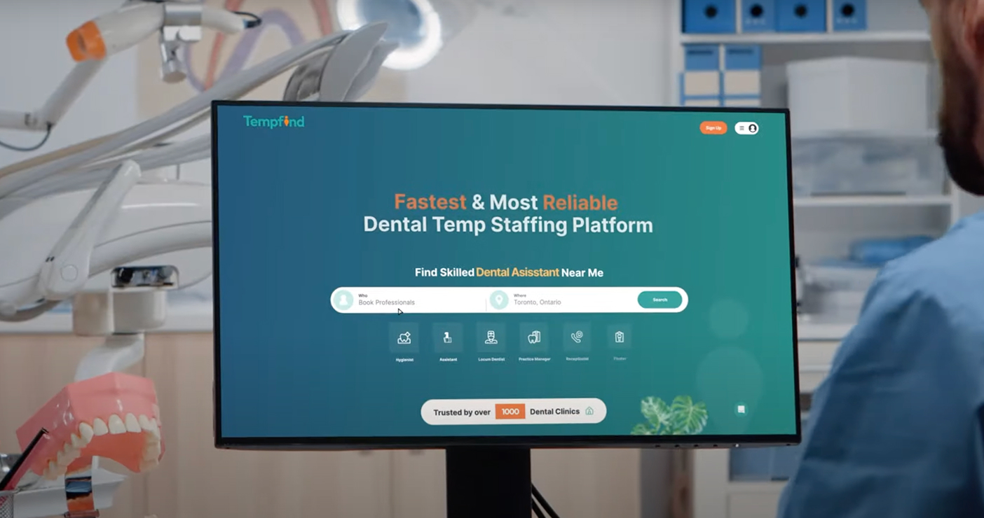 Tempfind dental staffing platform displayed on a clinic monitor, showing the homepage search to find dental professionals.
