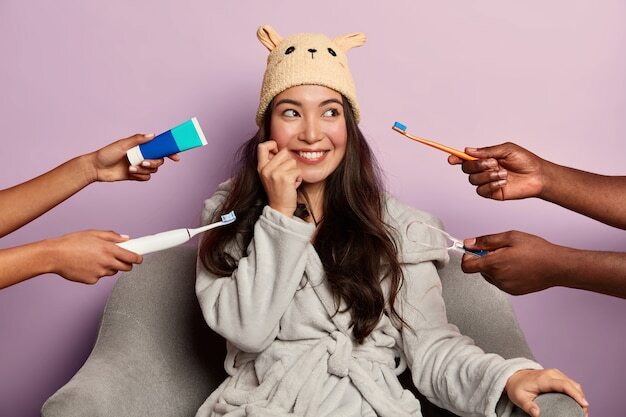 Smiling woman surrounded by toothbrushes and toothpaste