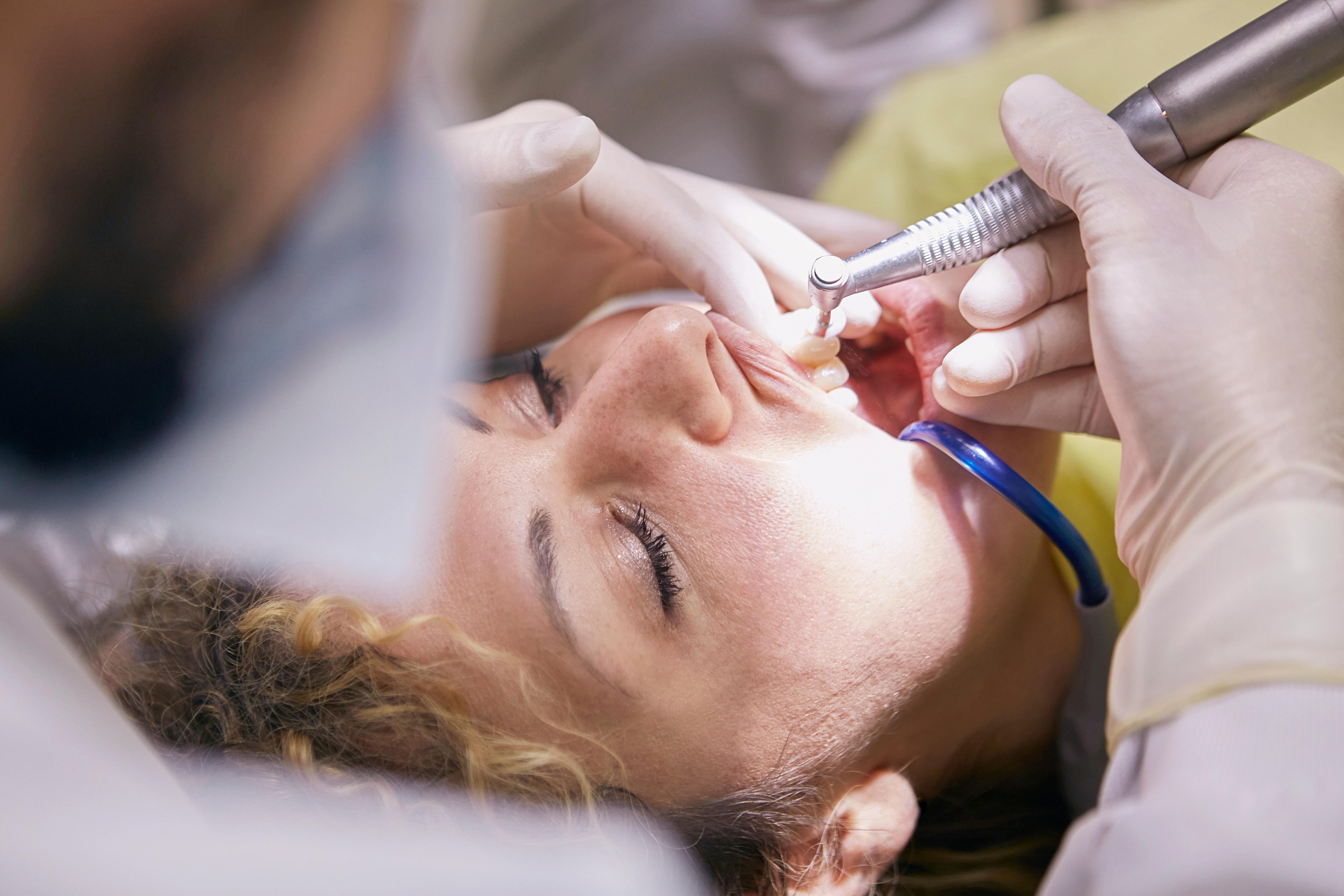 Dentist performing a dental procedure on a patient