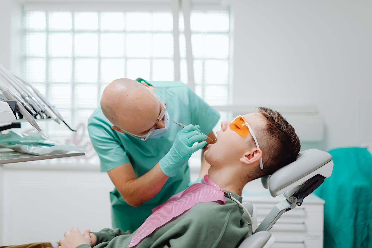 man having his dental checkup with his dentist